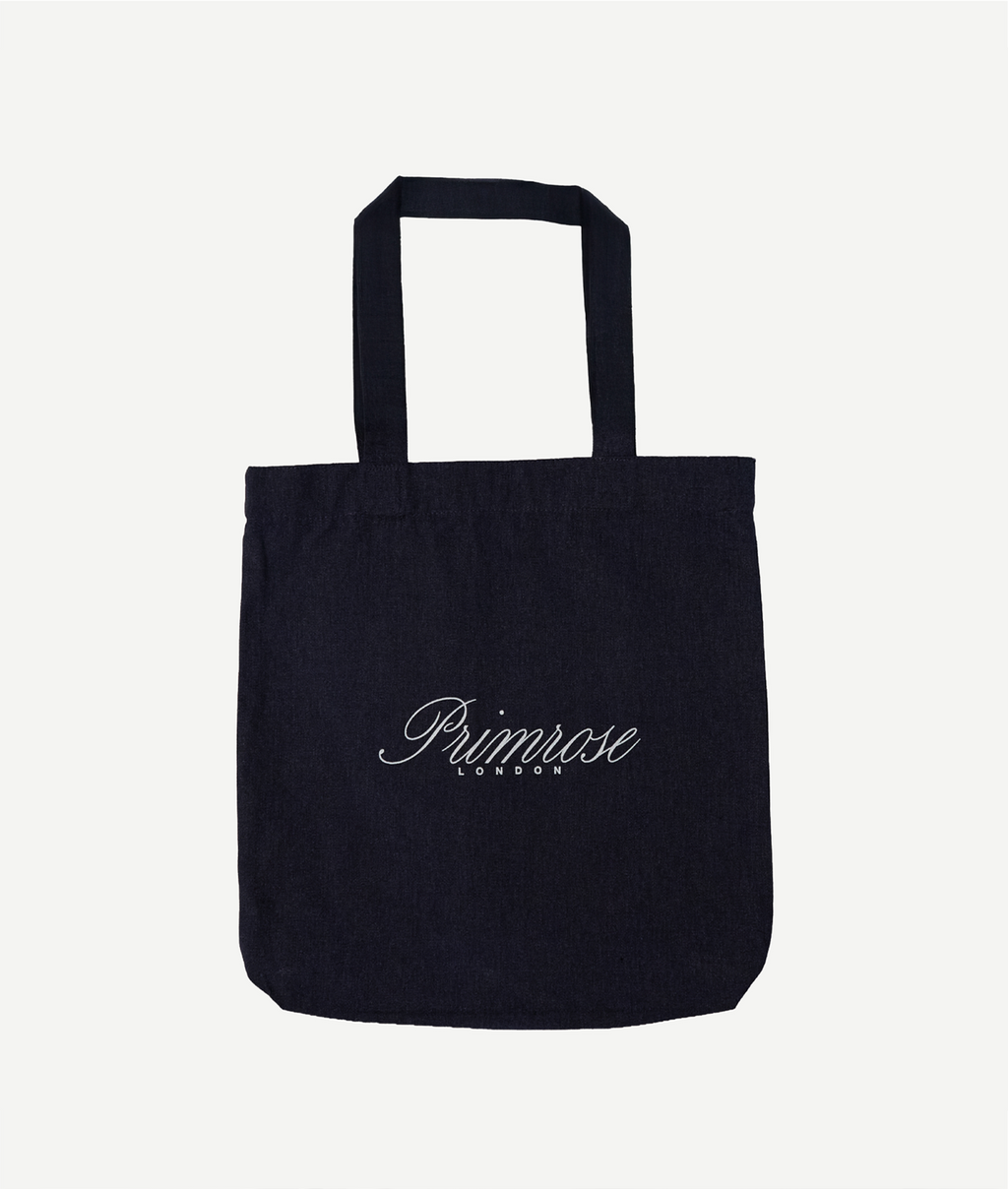 Black tote bag with 'Primrose London' branding on a white background