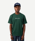 Person wearing a green t-shirt and navy cap on a white background embroidered with The View's So Nice